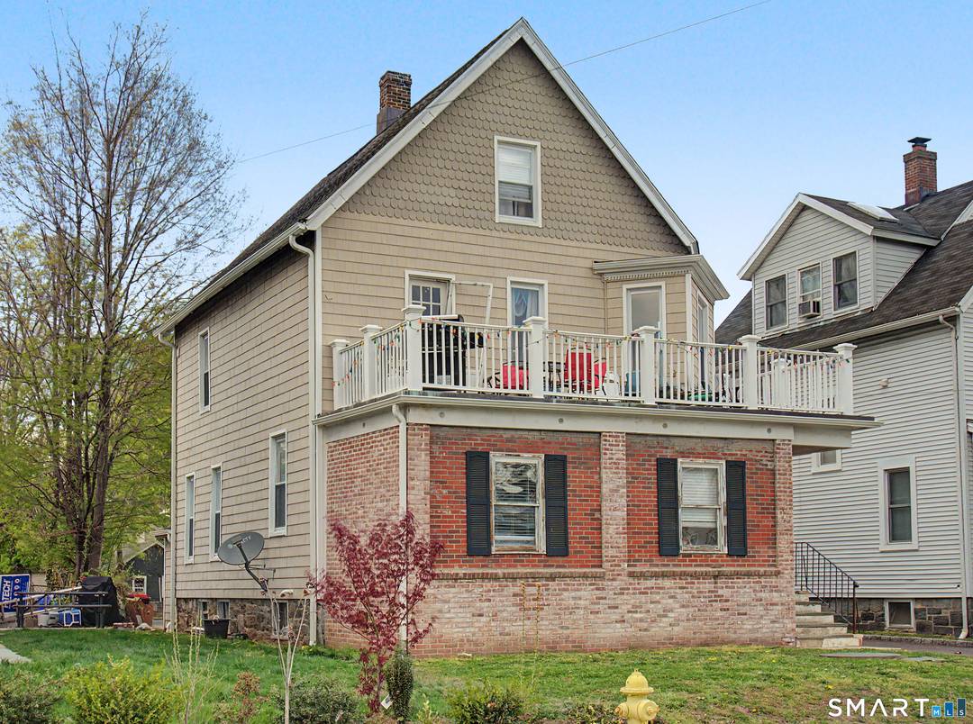 2 detached two family houses on a tree lined street in a quiet norwalk neighborhood.
