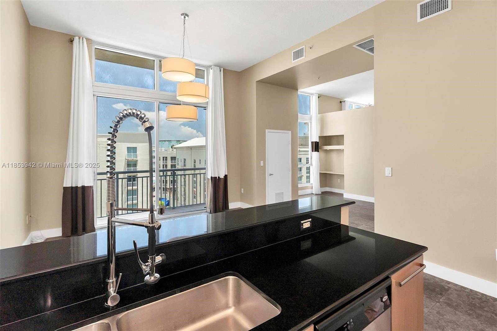 Unique loft style corner unit featuring 2 beds 1 bath, soaring 13' ceilings, beige kitchen cabinets with stainless steel appliances, new energy efficient Bosch AC unit, 2 in 1 washer ...