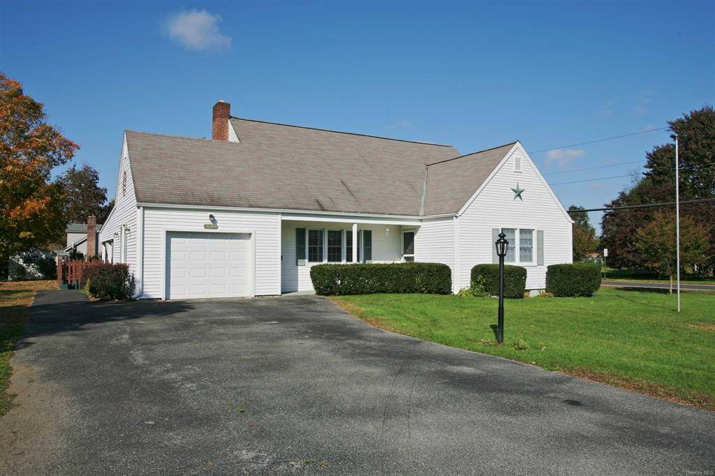 Charming village cape offers 3 large bedrooms, large living room a wonderful all season room off the rear.