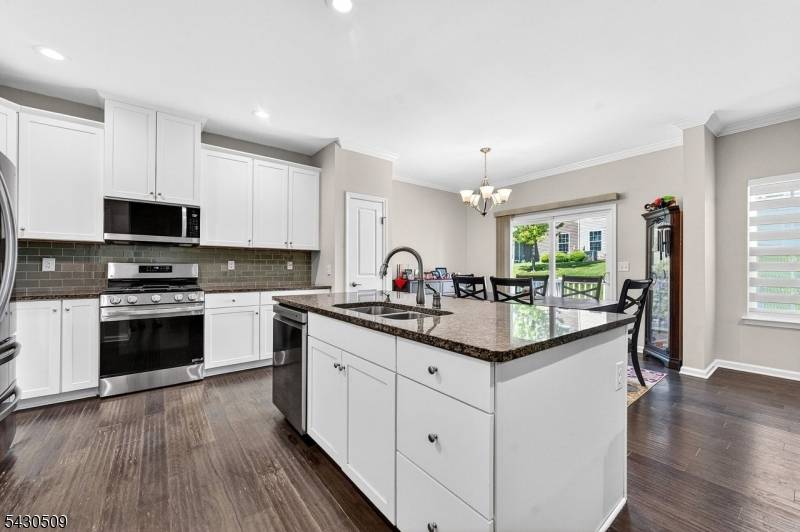Welcome to this stunning end unit, multi level townhouse in the highly sought after Shadow Woods community, offering breathtaking views and a low maintenance lifestyle.