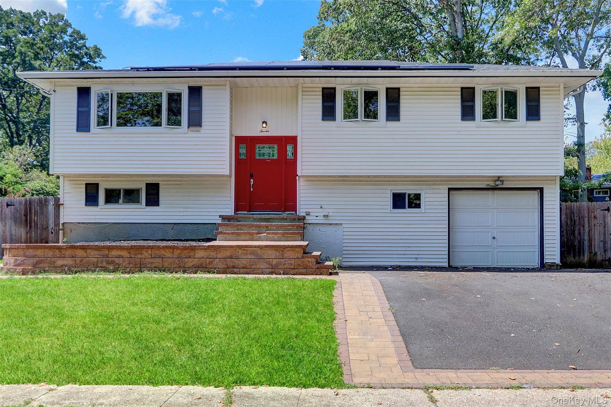 Discover modern living at 7 Walwin Place, a stunning hi ranch home situated on a quiet block in Huntington New York.