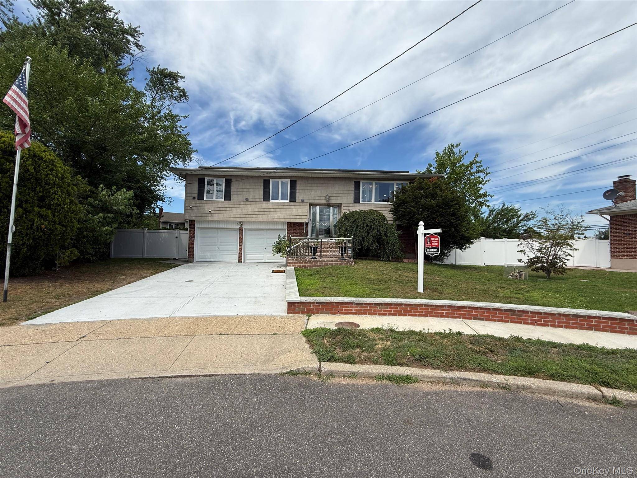 Totally renovated 4 Br, 2 bathroom, Wide line High Ranch, offering the ultimate entertaining space.