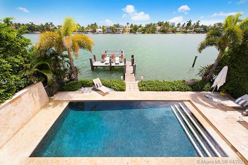 Fully renovated and modernized 4 bed 3 bath waterfront home with open living, media, kitchen and dining spaces perfect for entertaining.