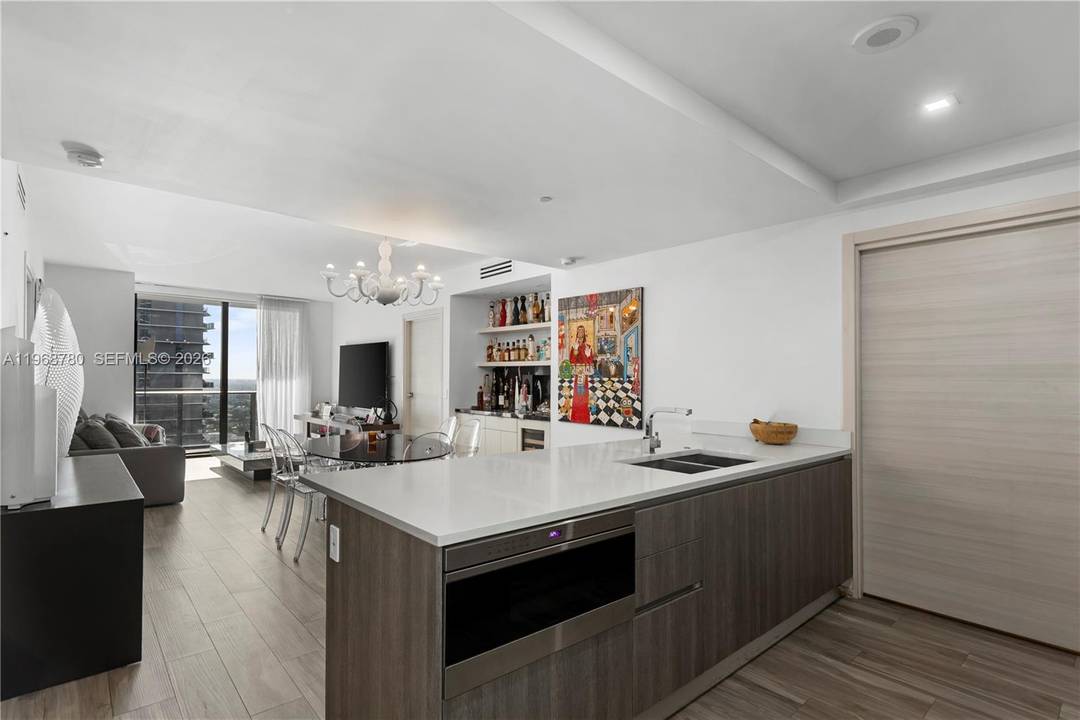 Spectacular condo at SLS LUX featuring private elevator entry, soaring ceilings, and a well designed layout with 2 bedrooms, 2 bathrooms, and a spacious den perfect for a home office ...