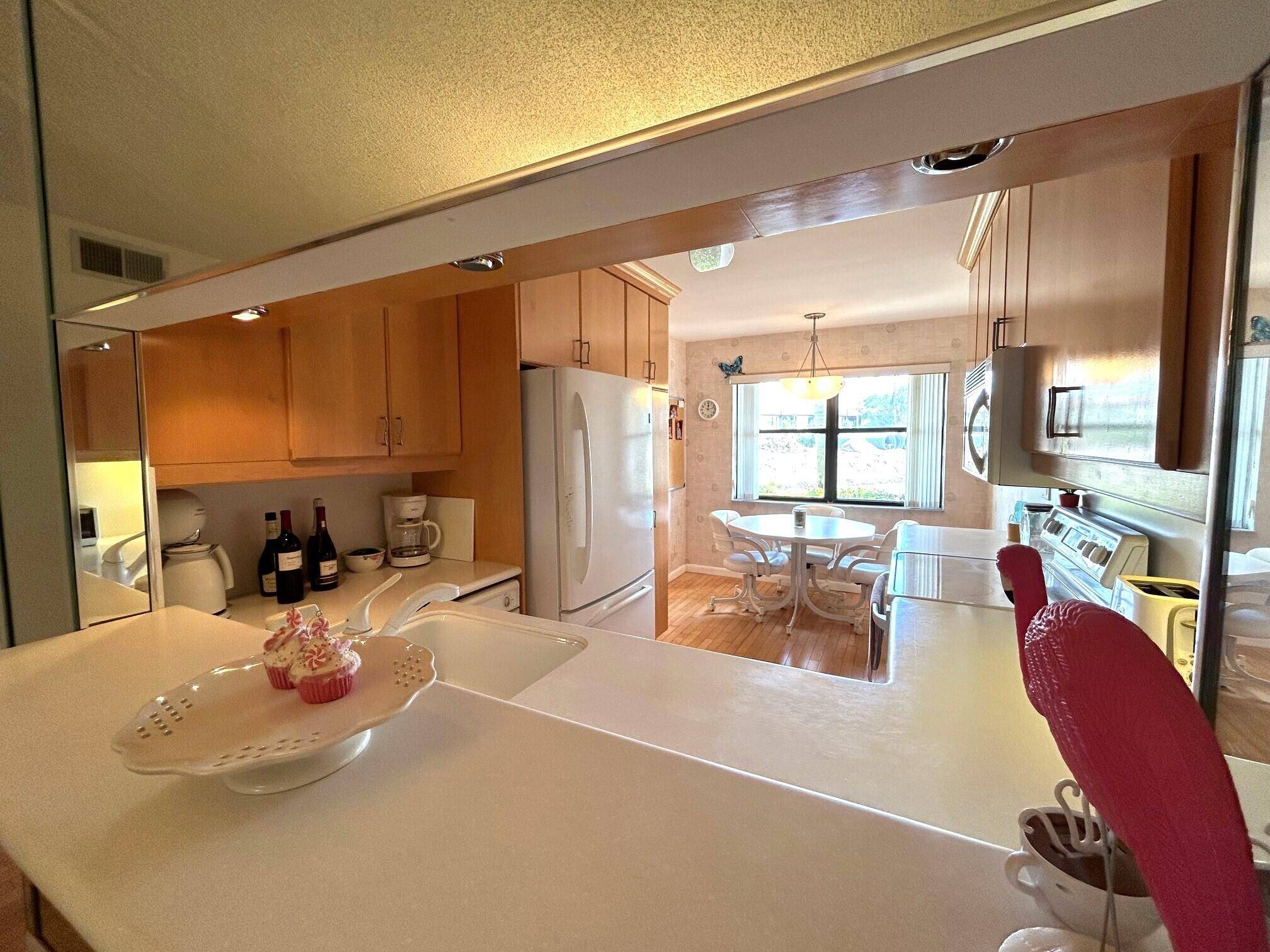 First floor corner condo located in the 55 community of Lucerne Lakes.