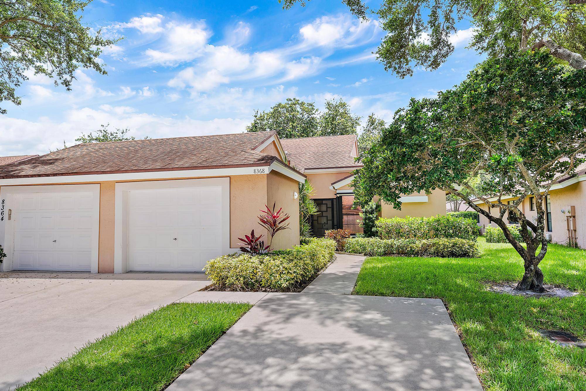Discover the potential of this rarely available, oversized 2 bedroom, 2 bath condo with a versatile flex space perfect for a home office, den, or easily converted third bedroom.