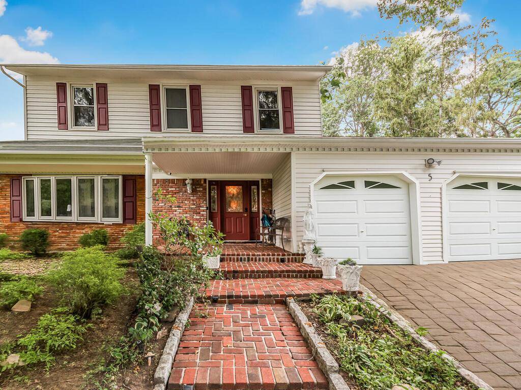 Welcome ! This timeless and spacious home is nestled on a tranquil cul de sac in New City, NY.