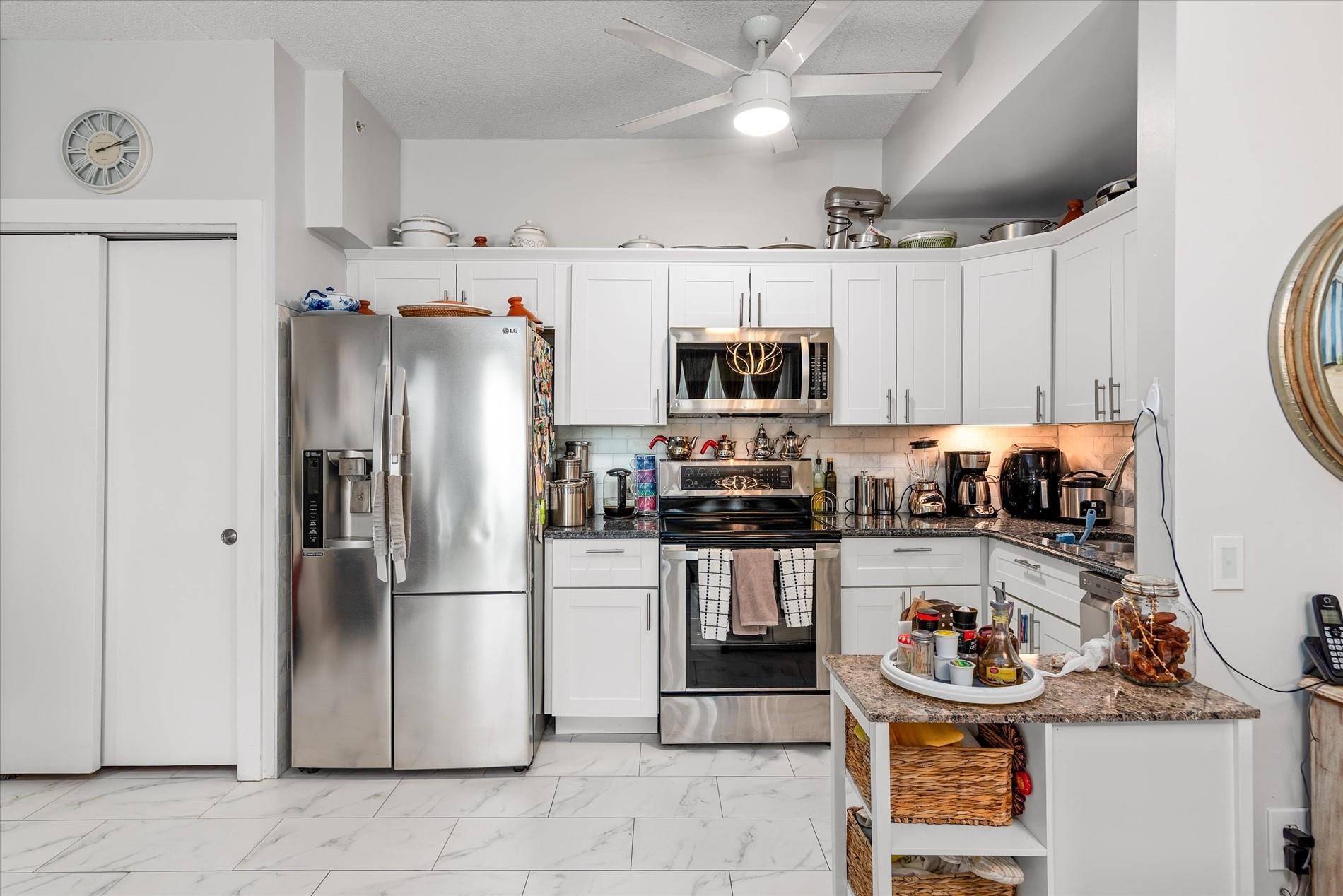 Excellent, Updated, Penthouse 2 Bedroom Condo For Sale with Balcony Water Views and a Private, Deeded Parking Spot Included.