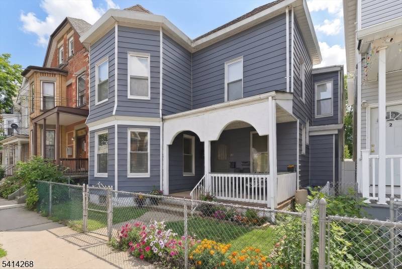 Enormous two family home offering a whopping 3, 917 square feet of living space, incredibly spacious rooms in both units and located near new large scale luxury apartment complexes !