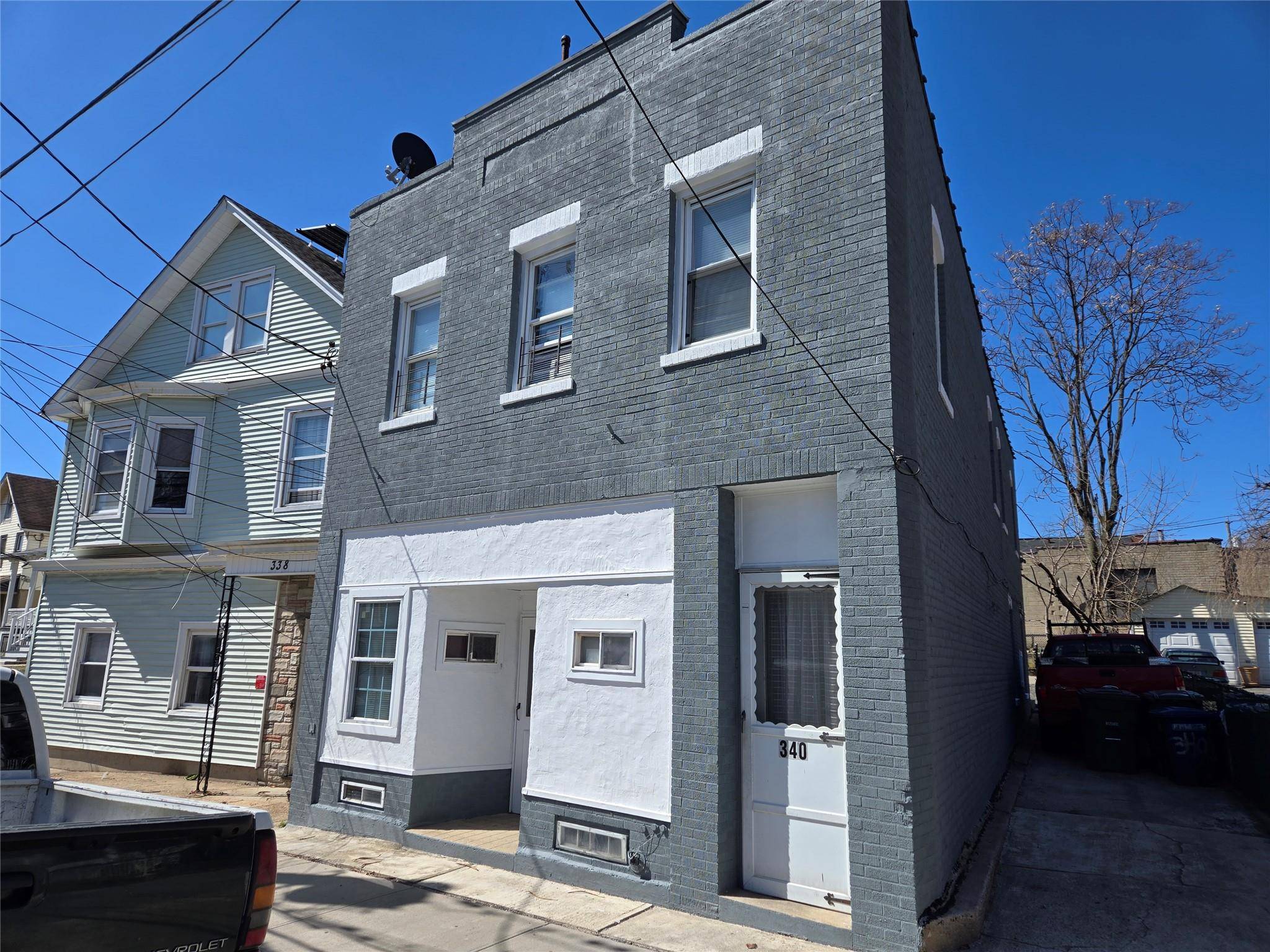 Presenting an upgraded legal three family residence, offering a blend of classic charm and modern amenities.