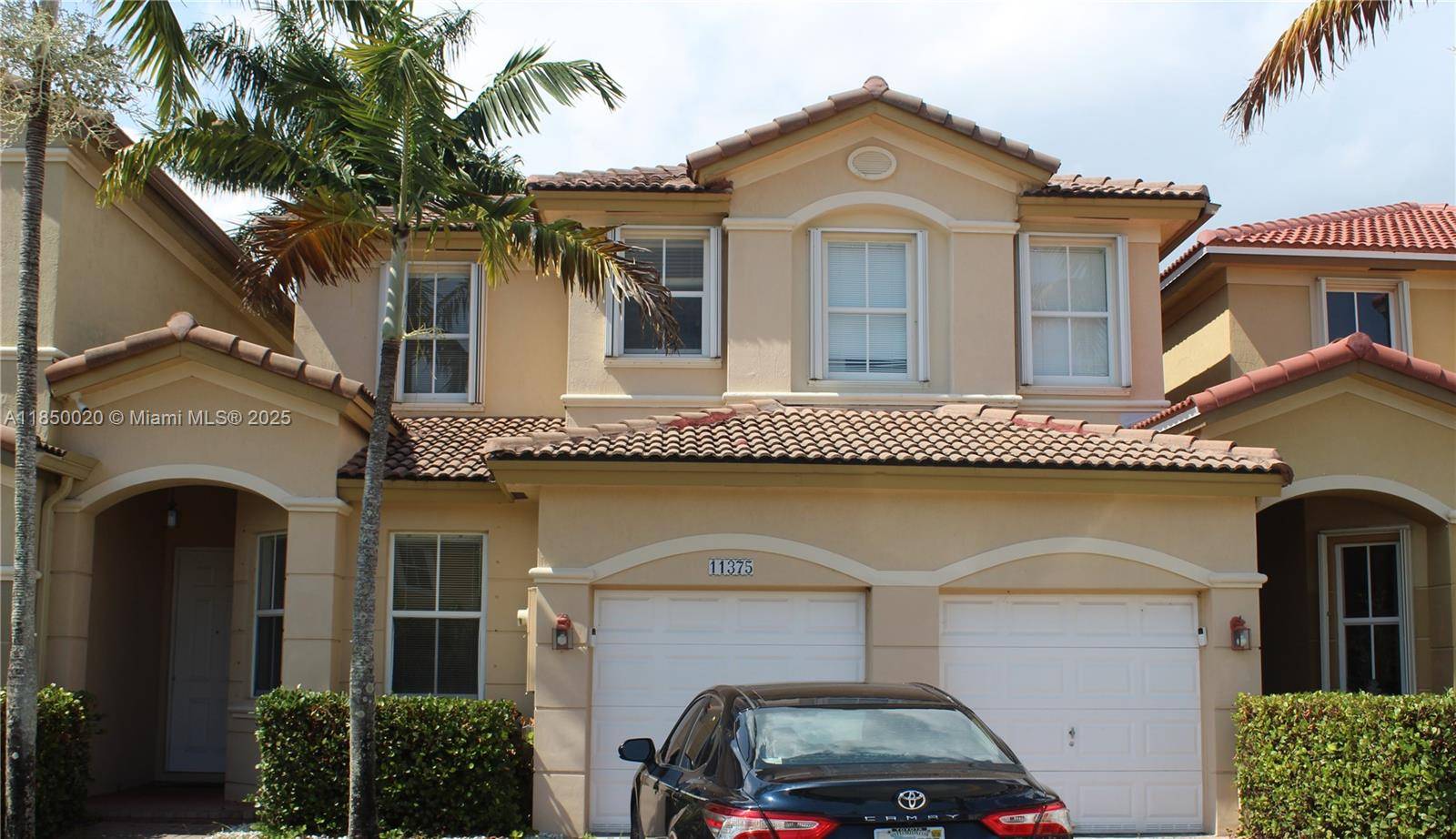 Relaxing, beautiful two story townhouse at Doral Isle North with a lake view, a large garage, with 1 room ground level.