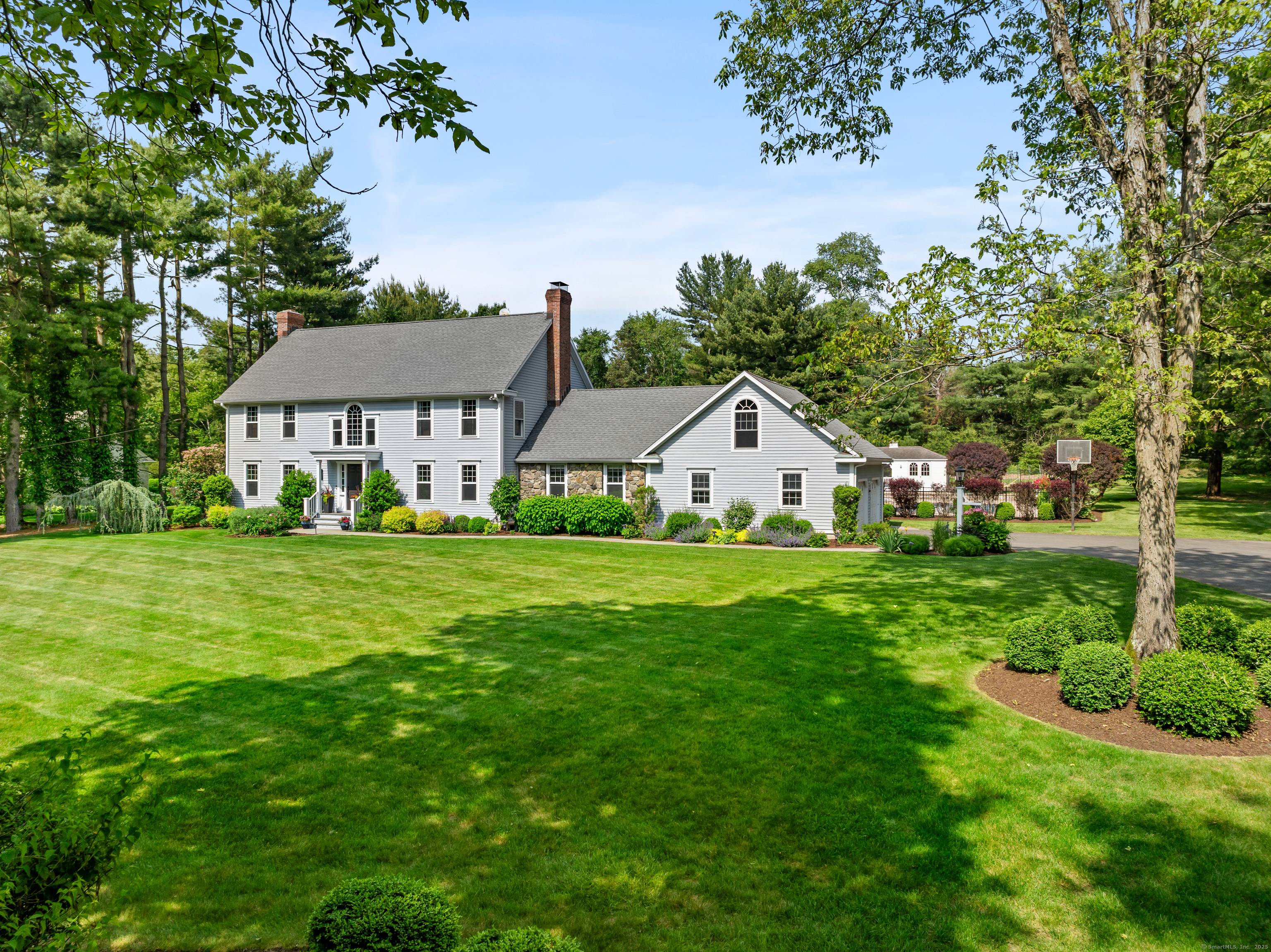 Discover this Connecticut Colonial, now with a dramatic price improvement, nestled on a peaceful cul de sac.