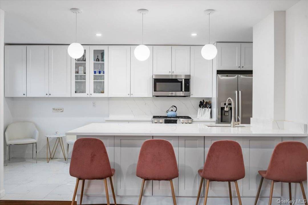 Gorgeous, completely renovated 2BR 2 bath unit in a doorman building steps away from train station.