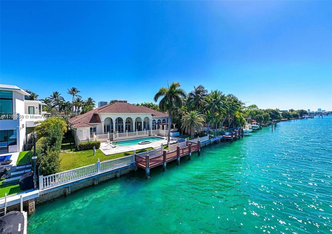 Tucked away in a private cul de sac, this Mediterranean estate offers over 100 feet of prime waterfront with breathtaking, bay views.