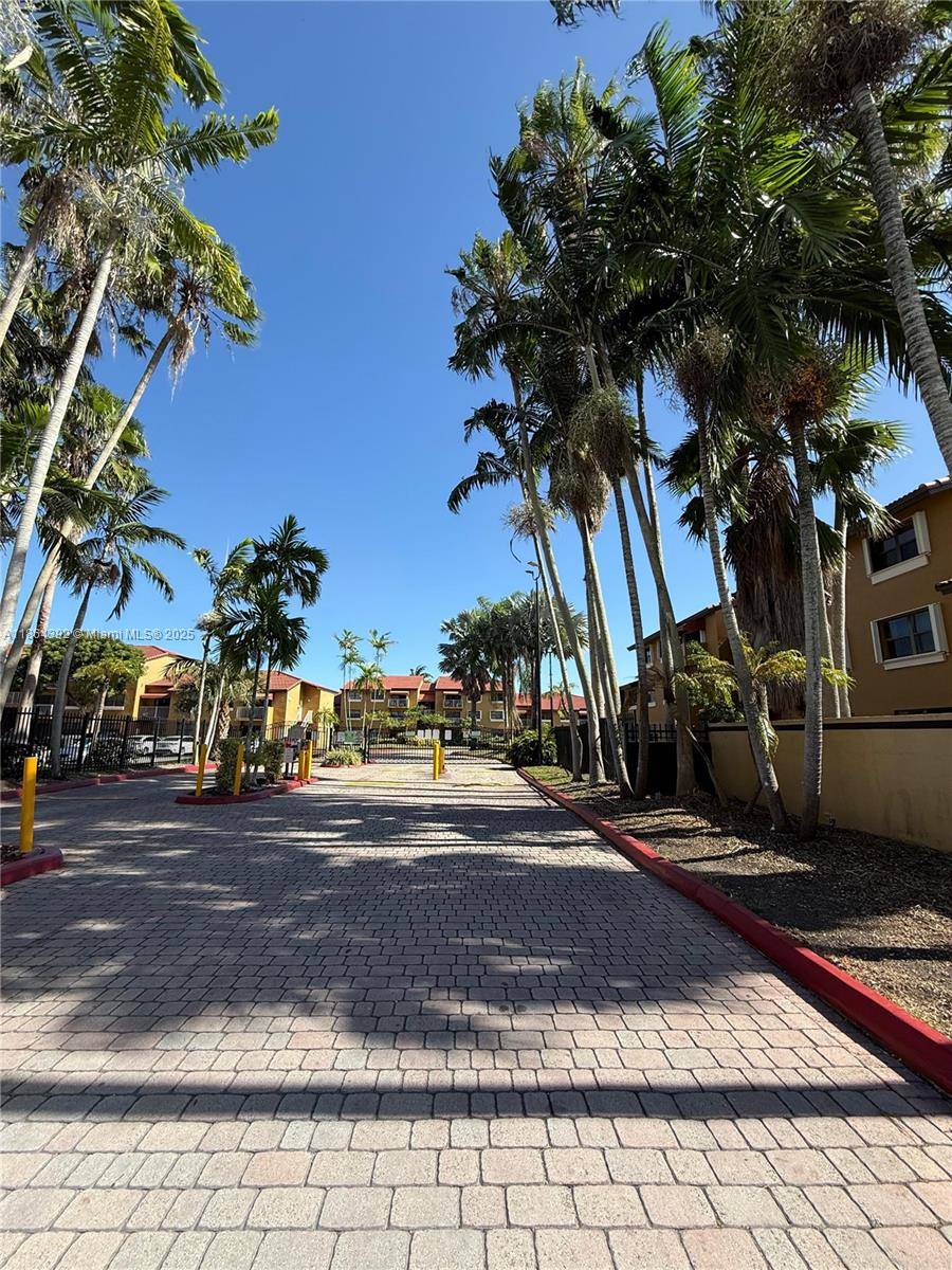 BACK ON MARKET ! Beautifully renovated 3 bedroom corner unit with private entrance located in a desirable gated community.