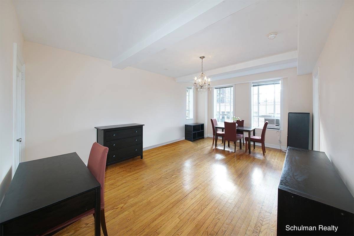 12H is an extra large studio with a separate windowed kitchen and an alcove sleeping area with a built in full size bed.