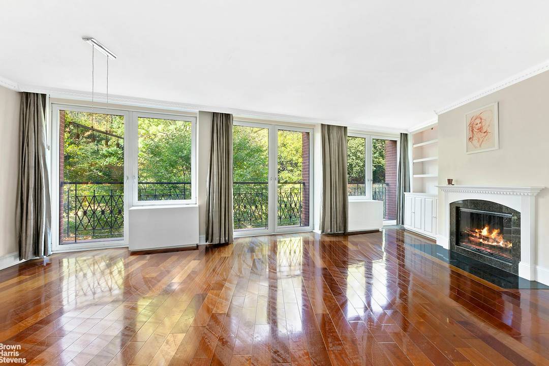 Unobstructed Morningside Park views from a 28 foot wide wall of floor to ceiling windows !