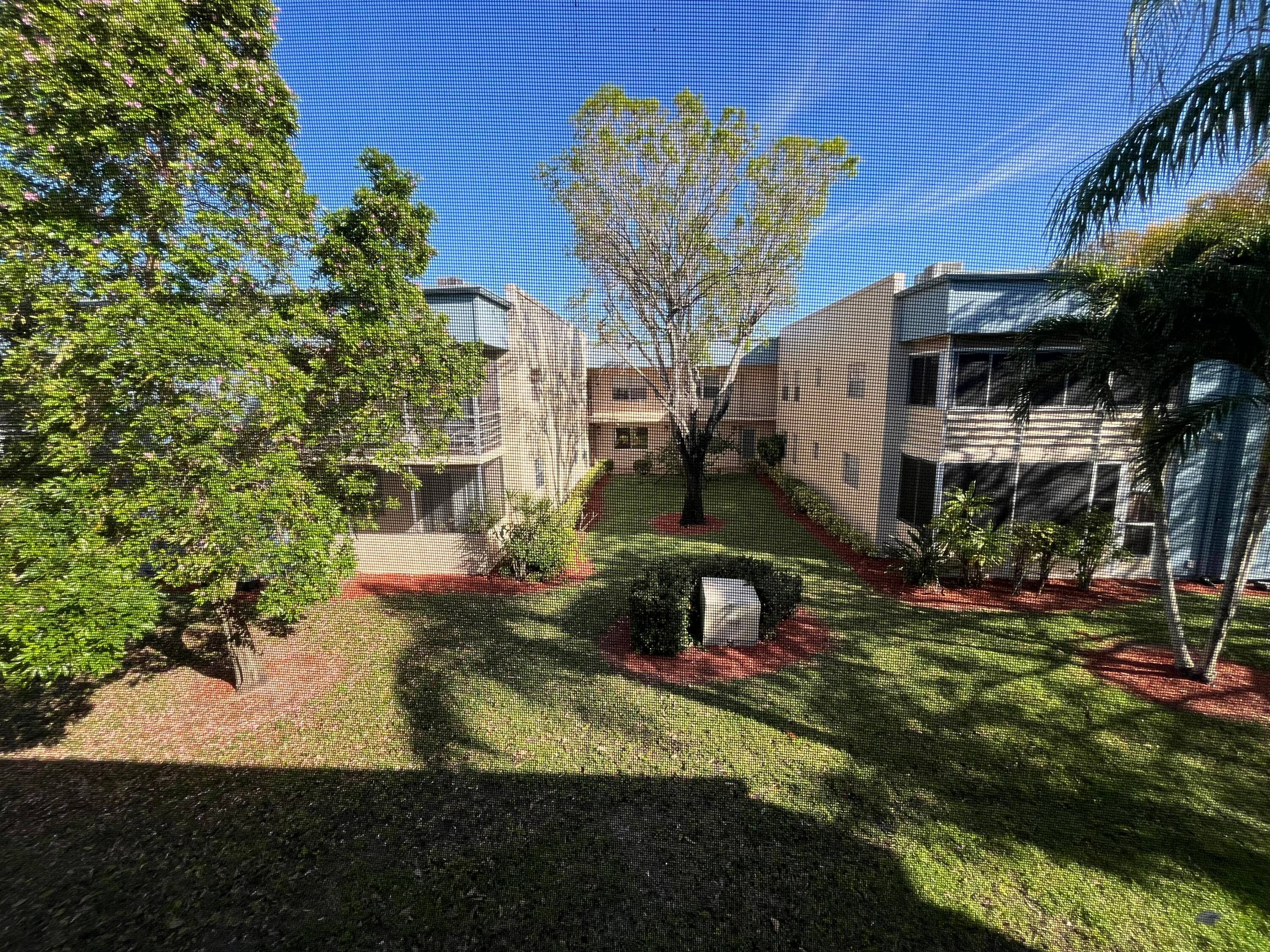 Turnkey, gorgeous 2nd floor 2 2 with a very private secluded garden view from your rear screened in patio.