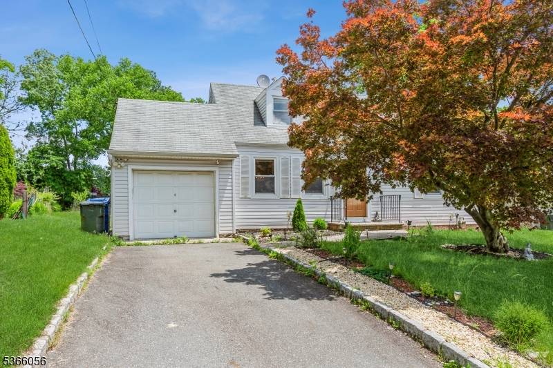 Welcome to 8 Longfellow Drive, a beautiful Cape Cod style home located in the highly sought after Colonia Estates section of Woodbridge Twp.