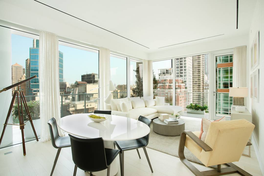 This spacious, corner 1, 416 square foot two bedroom, two and a half bath residence features a deep wraparound terrace overlooking Central Park, and western views of the Midtown skyline.