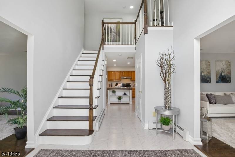 Stately, elegant inviting describes this custom L shaped colonial nestled on a pristinely manicured corner property at the beginning of a cul de sac.