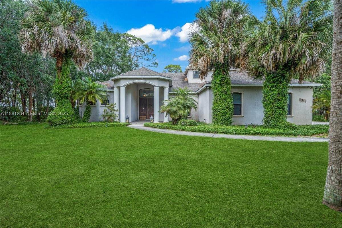 Rare Waterfront Home in a peaceful community with Space Launch Views !