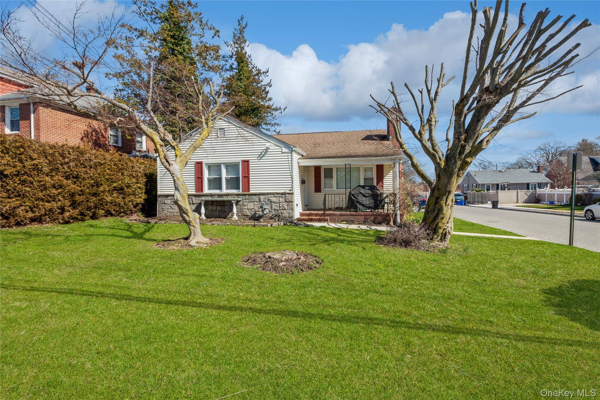 Charming 3 bedroom, 2 bath ranch style home on a spacious corner lot in desirable Glen Cove.