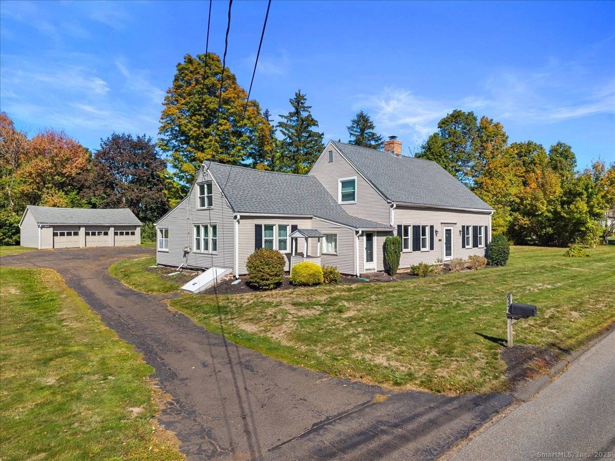 This 2, 702 sq ft Cape style home sits on a private 1.
