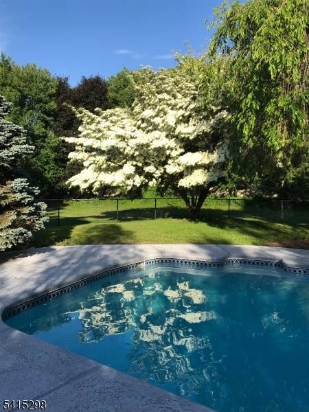 Set behind a long, private approach and surrounded by mature trees, this 4 bedroom, 4 bath residence offers a rare sense of seclusion, space, and light in one of Boonton ...