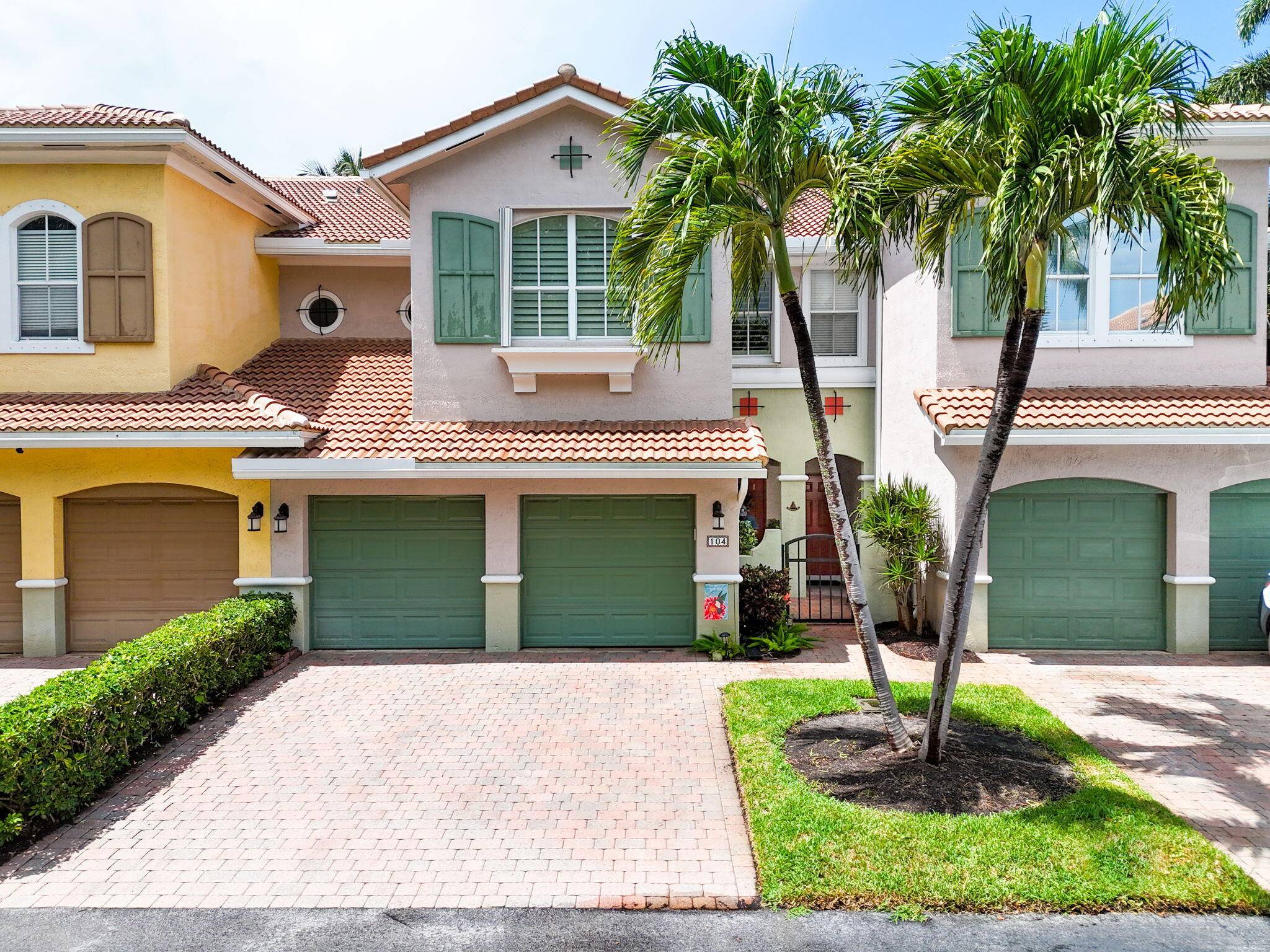 Welcome home to 104 Las Brisas Circle, a beautifully updated townhome in the gated Intracoastal community of Las Brisas in Hypoluxo.