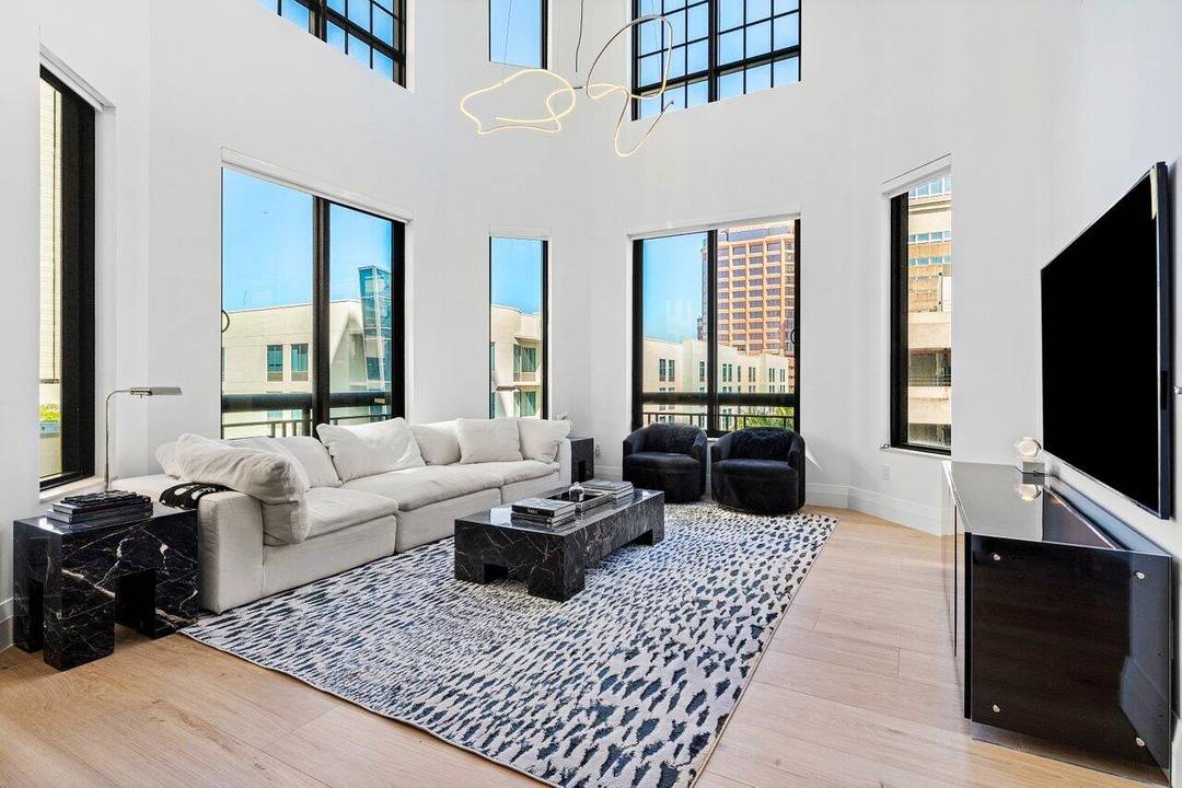 Live at the center of it all in this fully renovated, two story corner residence at the coveted One City Plaza.