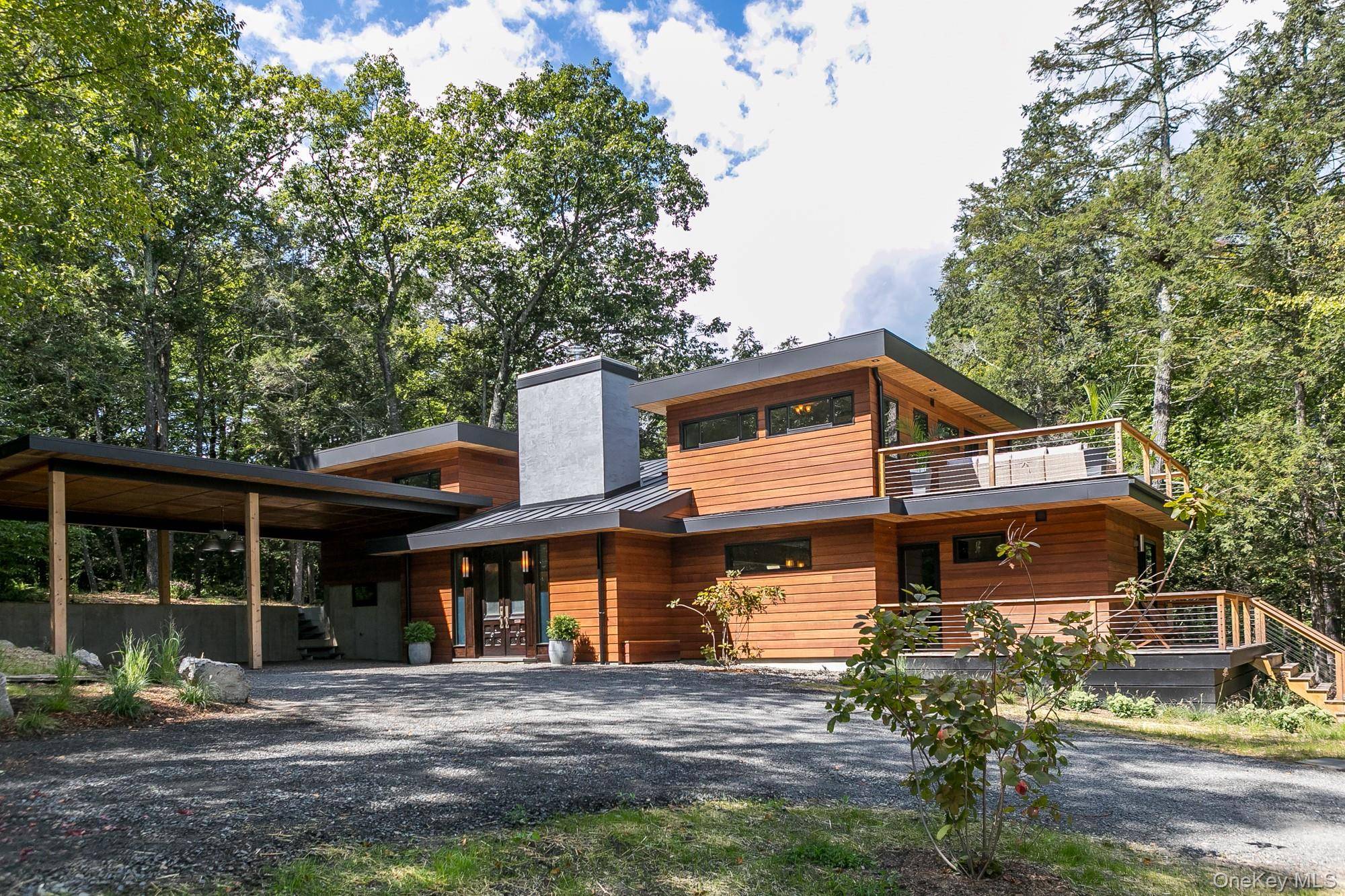 Perched sixty feet above the Muddy Kill Creek in Stone Ridge, this newly built home, named ''Fern Hollow'', blends mid century modern inspiration with one of a kind details, offering ...