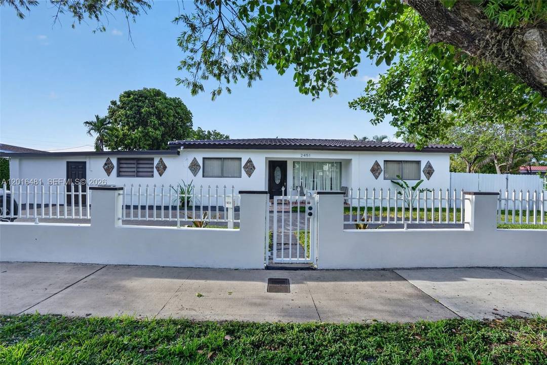 Tucked behind a private gated entry in the heart of Miami, this unique property offers a rare opportunity to combine comfortable living with income producing potential.