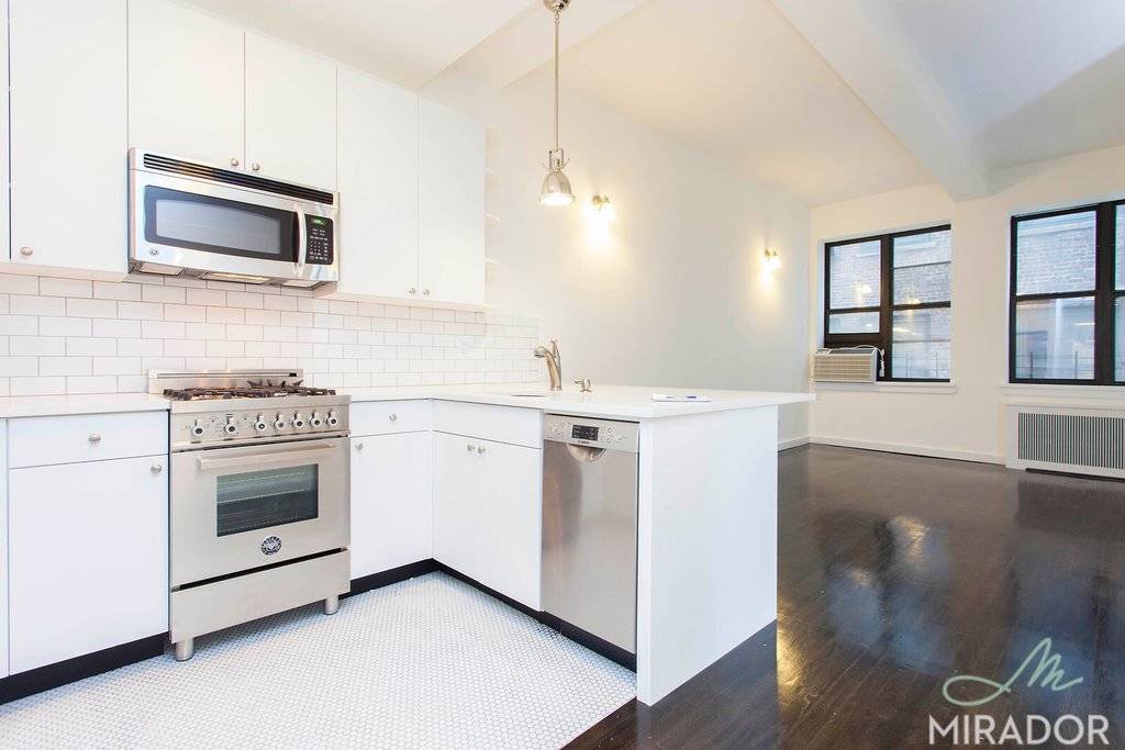 This modern, renovated, two bedroom home is perfect for entertaining with high ceilings and hardwood floors throughout.