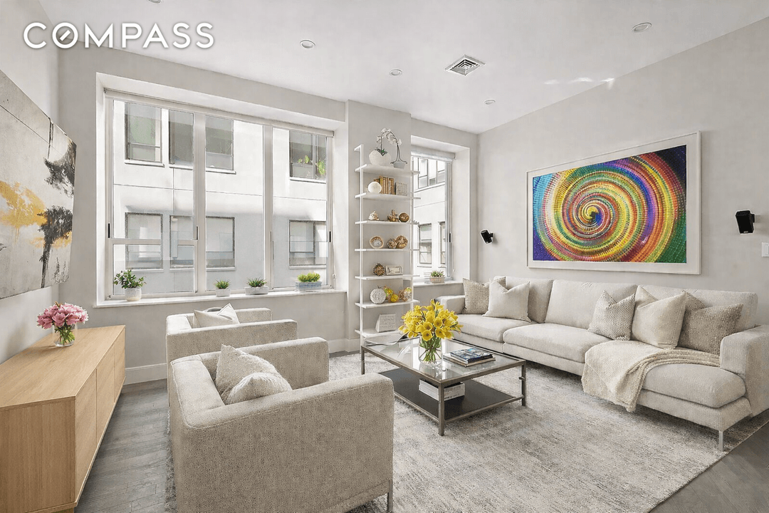 Zen Garden Duplex 2BR Flexible Third Suite 3BA Direct Amenity Access Prime Midtown West A rare garden facing duplex residence at 416 West 52nd Street, TH205, offering exceptional scale, privacy, ...
