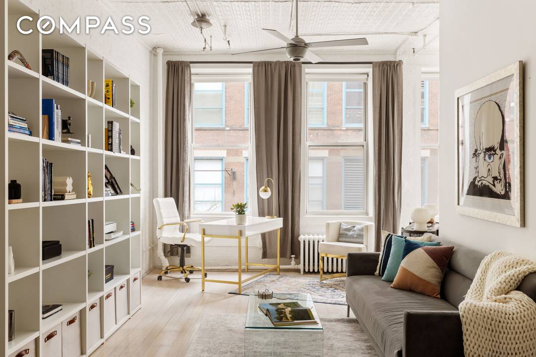 Iconic Pre War Loft in the Heart of Greenwich Village This architecturally stunning pre war loft seamlessly blends historic charm with modern living.