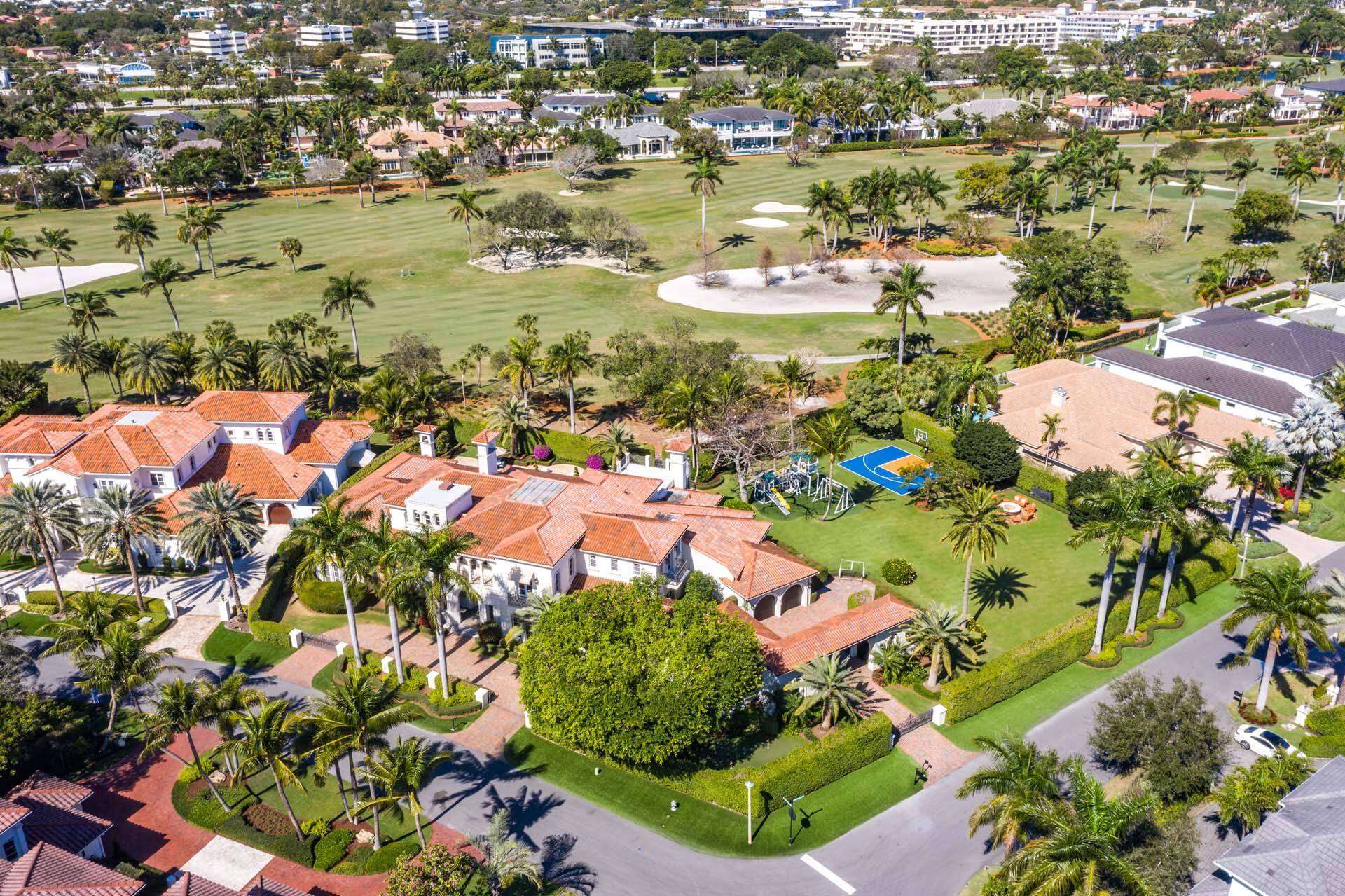 A rare opportunity to own nearly an acre of land on the golf course in Royal Palm Yacht Country Club complete with a sports court.