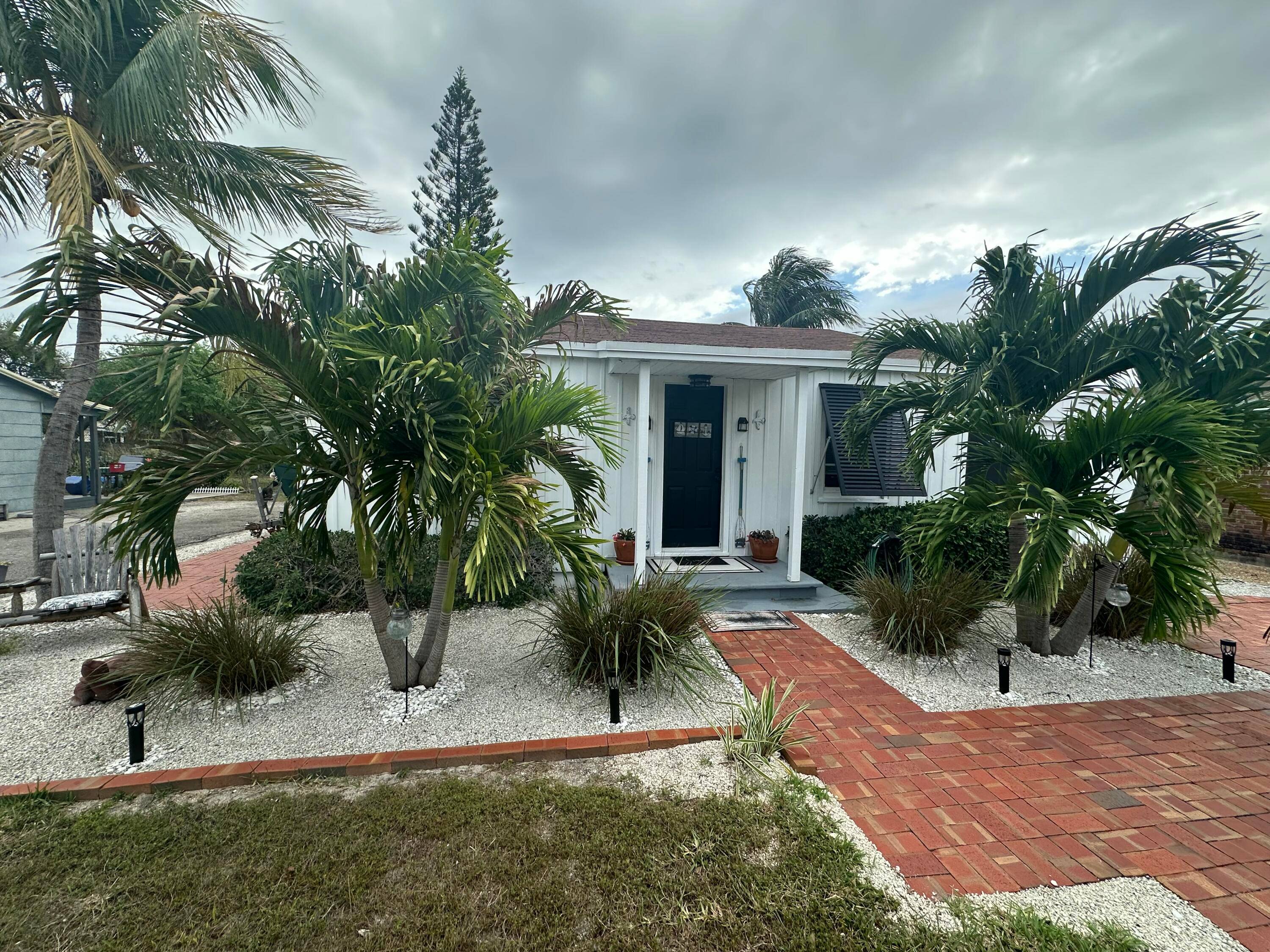 Key West style 2 Bedroom 1 Bath with loft, Large Paver Driveway, Paver Parking On Side For Boat Parking, Single family home in the heart of Lantana.