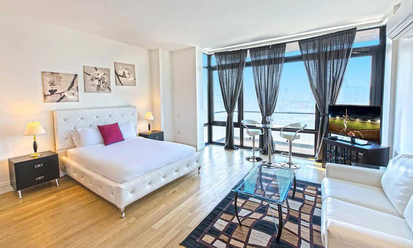New to market South facing apartment with floor to ceiling windows and a private balcony.