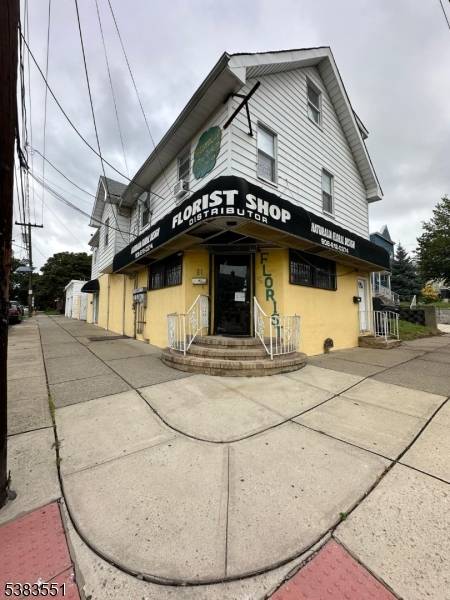 Building with one commercial space first floor using as a Flower Shop sell separate 90, 000 and 2 duplex apartment with 3 beds and 2 bath each apartment.