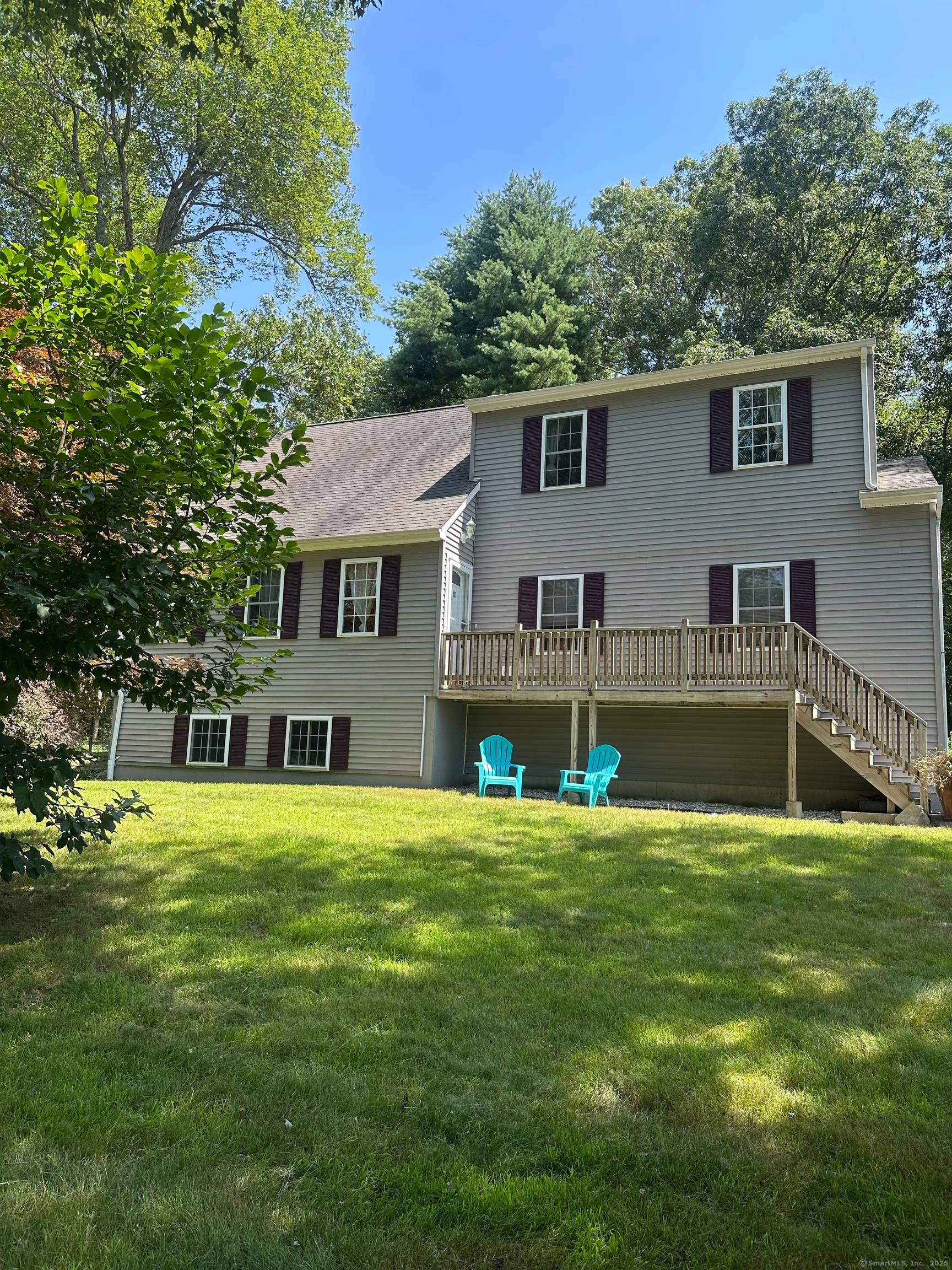 Welcome to this beautifully maintained Colonial Contemporary home, set on a generous 1.