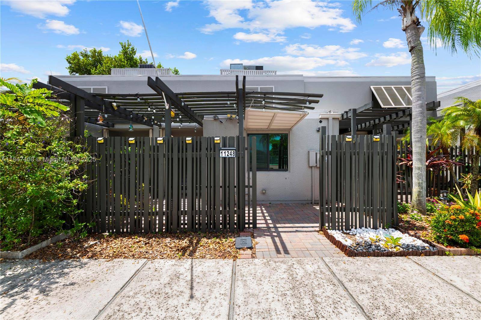 This updated 2 story waterfront Townhome in Villas Lakes features 2 bedrooms, 2 bathrooms, an open kitchen with wood cabinets and granite counters overlooking the great room, a custom bar ...