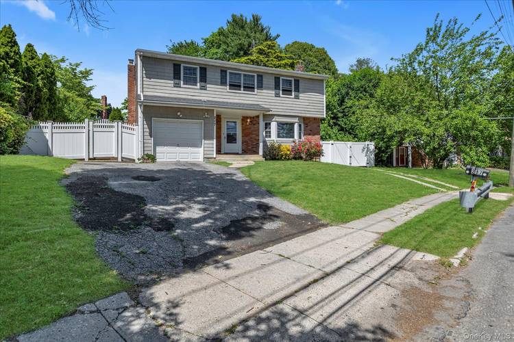Large Bright Colonial. With Central A C, and beautiful full fenced yard.