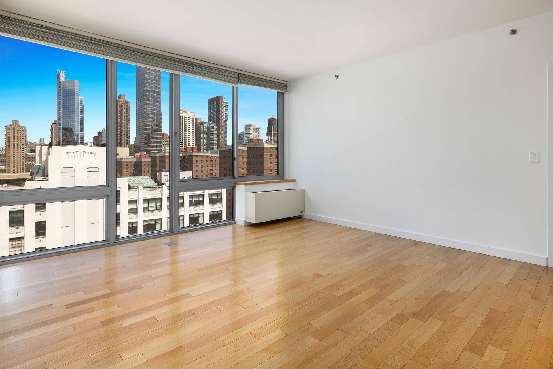 Sunlit two bedroom, two bathroom condominium with city views and in unit washer and dryer.