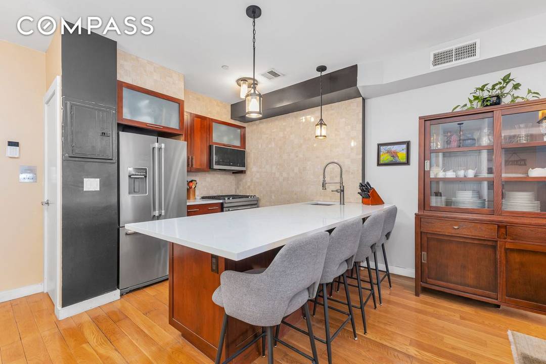 Experience the perfect blend of indoor outdoor living in this stunning lower duplex residence on Humboldt Street in the heart of vibrant East Williamsburg.