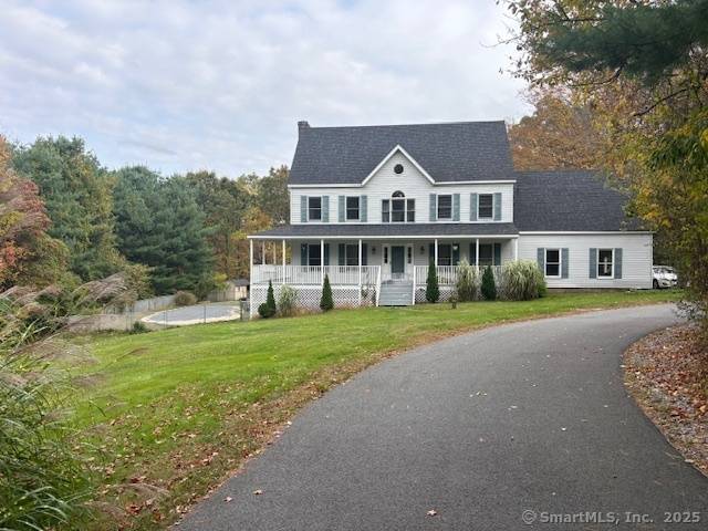 Nestled on a peaceful country road, this spacious Colonial offers 4 bedrooms and 2.