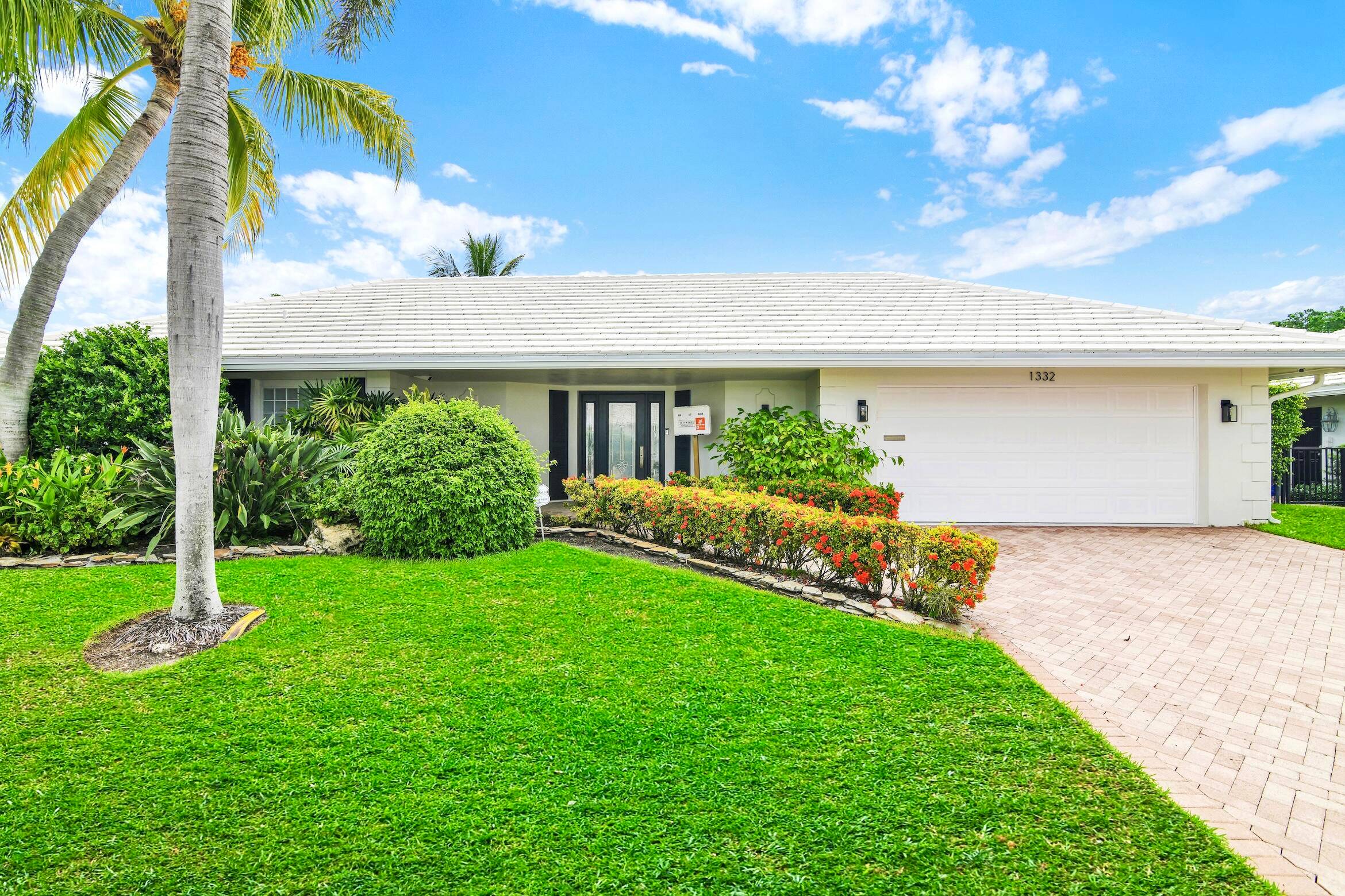 A rare, newly renovated Camino Gardens waterfront residence with 85 ft of frontage and ocean access.