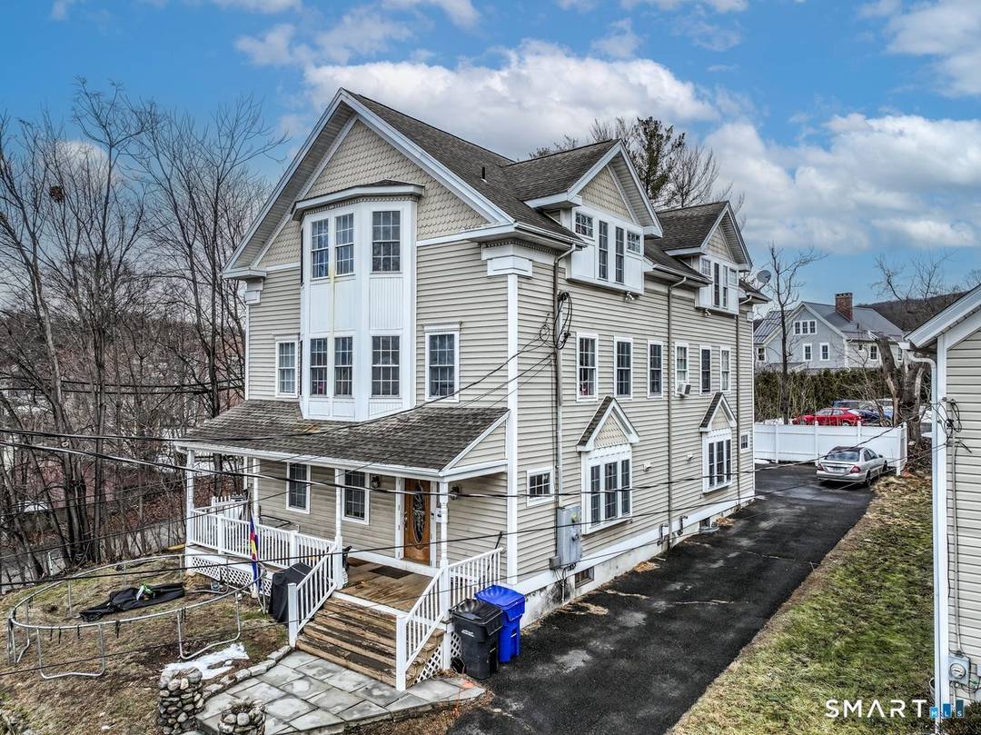 Multi family home located in the heart of New Milford, offering a walkable location close to the Village Green, train station, shopping, dining, theater, parks and local amenities.
