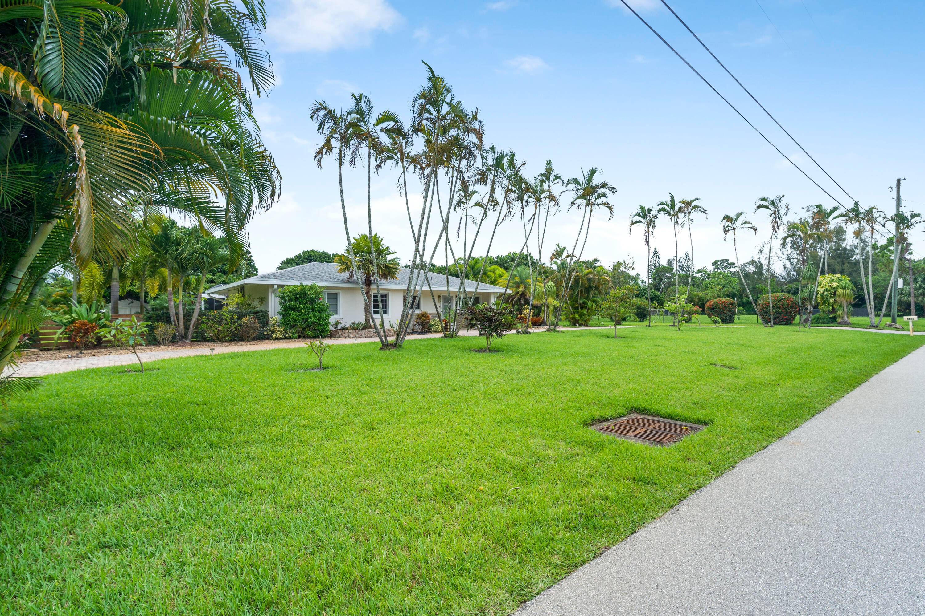 This updated open floor plan home features modern cabinetry, quartz countertops, stainless steel appliances, premium ceiling fans and lighting, a skylight, four sun tunnels, two custom fireplaces, TVs, and ample ...