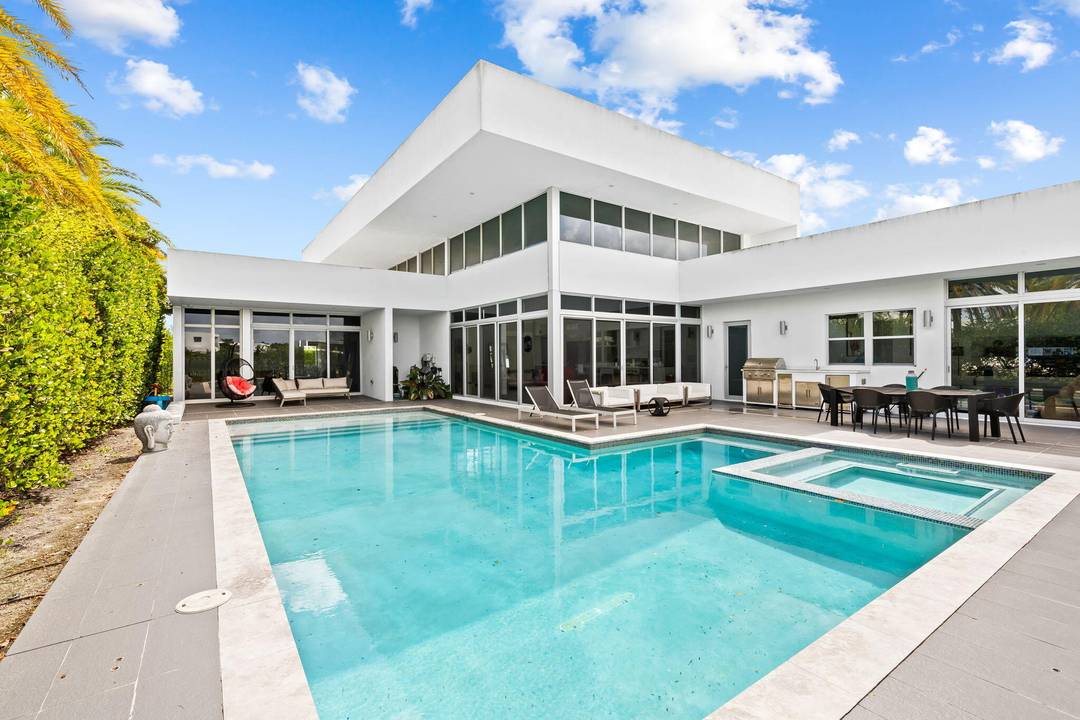 Welcome to 16758 Natures Way, a one of a kind home in the heart of Weston, FL, blending tranquility with modern living.